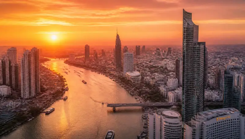 Bangkok skyline at sunset seen from a rooftop